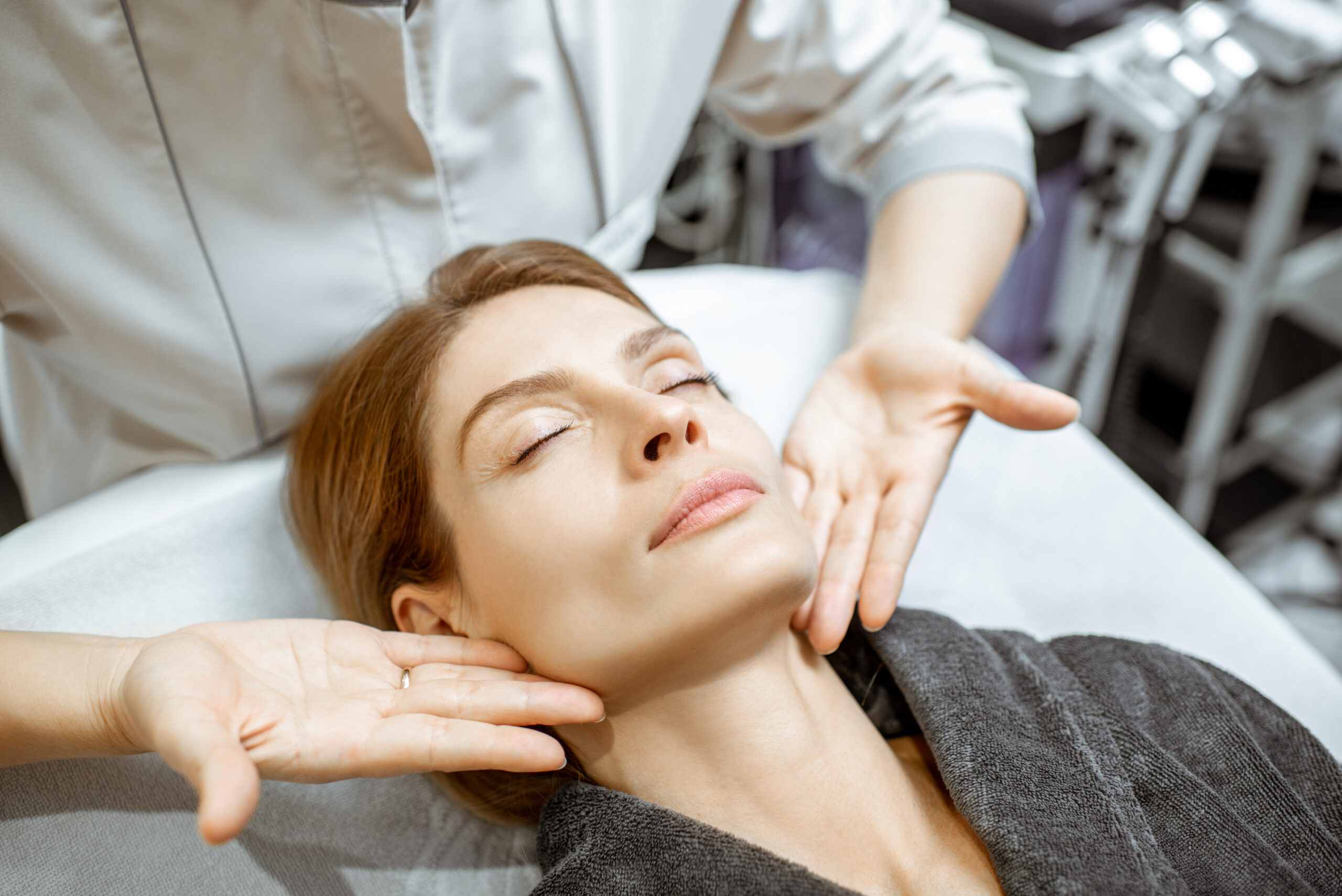 Woman during the facial massage at the beaty salon